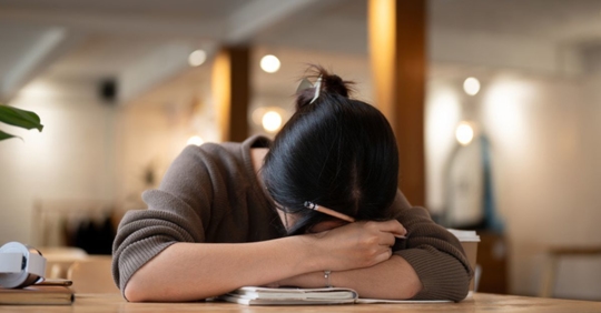 sad young woman in school